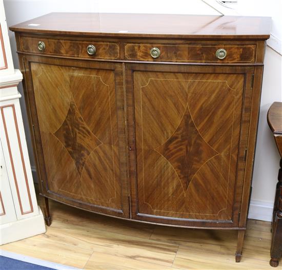 A Waring & Gillow inlaid cabinet W.107cm